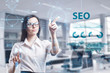© photon_photo - The concept of business, technology, the Internet and the network. A young entrepreneur working on a virtual screen of the future and sees the inscription: SEO