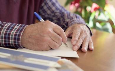 Wall Mural - old man writing christmas cards