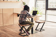 © LIGHTFIELD STUDIOS - african american man using laptop in coffee shop