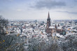 High Angle View of snow covered Freiburg City with Freiburg Minster, against blue sky