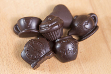 Homemade no sugar proper nutrition chocolate candies on a wooden background. Healthy food