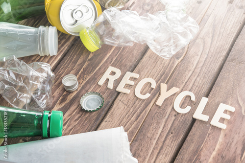 Recycle Word Made From Wooden Letters With Recyclable Garbage On