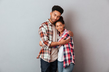 Poster - Portrait of a loving young african couple hugging