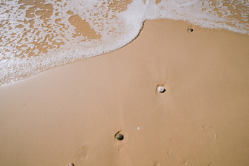 Beach with waves and stones in Portugal