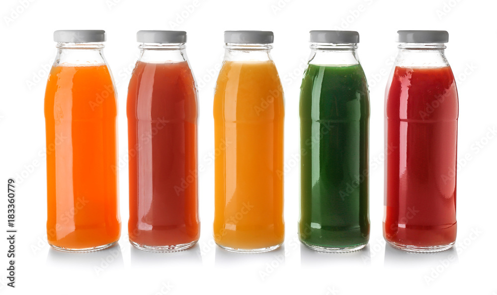 Bottles with juices on white background