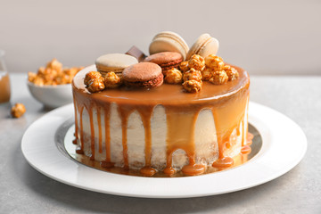 Sticker - Plate with delicious caramel cake on table