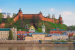 Nizhny Novgorod Kremlin and city buildings at sunset with the Volga River