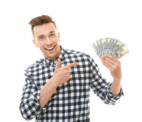 Happy young man with banknotes on white background