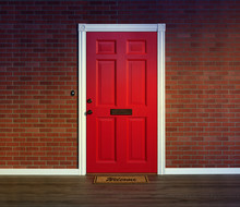 Bright Red Front Door And Welcome Mat With Wood Porch Floor.