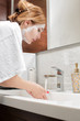 © producer - attractive woman to wash in bathroom