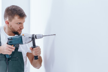 Wall Mural - Male with a drill