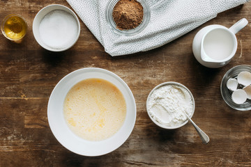 Wall Mural - top view of ingredients for pastry composition on wooden table