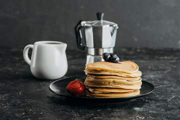 Wall Mural - stack of freshly baked pancakes with mocha pot and milk jug