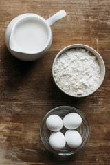 Wall Mural - top view of fresh ingredients for pastry on wooden table