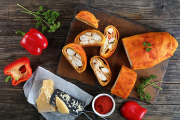 Wall Mural - chicken meat Strudel with cheese, top view