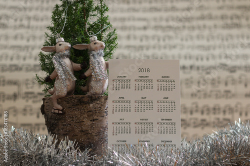 Calendar of 2018 year with winter festive decoration & a cute ...