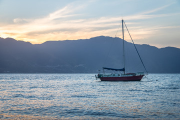 Poster - Sailboat at sunset with Sao Sebastiao on background - Ilhabela, Sao Paulo, Brazil