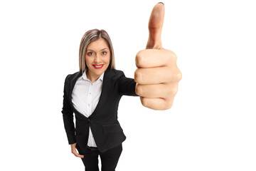 Poster - Elegant young woman making a thumb up sign