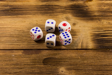 White dice on wooden table. Game of chance concept