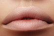 © marinafrost - Moisturizing lip balm, lipstick. Close-up of beautiful sexy lips. Full lips with natural lip makeup. Filler Injections