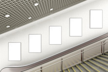 Blank advertising poster on underground escalator wall