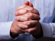© StockPhotosArt - Close up or closeup of hands of faithful mature man praying. Hands folded, interlaced fingers in worship to god. Concept for religion, faith, prayer and spirituality.