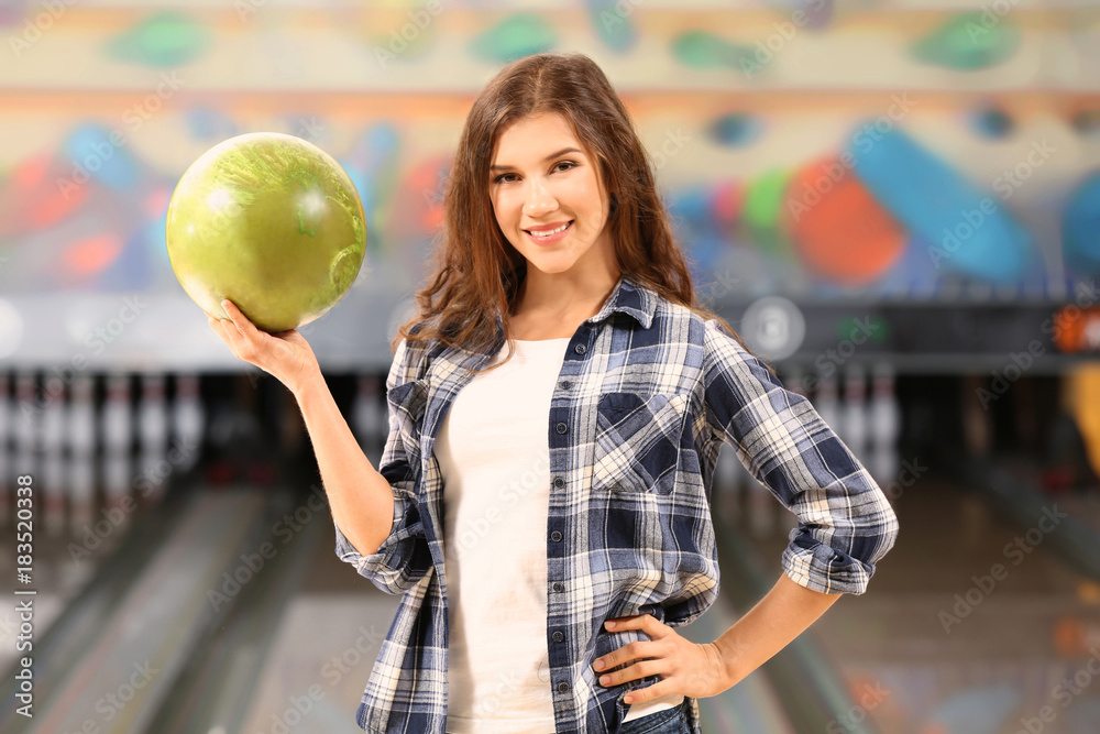 Beautiful young woman at bowling club