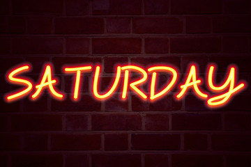 Saturday neon sign on brick wall background. Fluorescent Neon tube Sign on brickwork Business concept for Happy Week Weekend 3D rendered