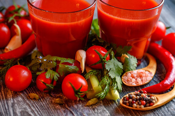 Glass of tomato juice with fresh tomatoes