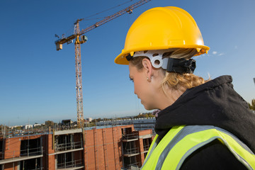 Wall Mural - female construction worker at rooftop