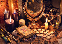 Old Books, Black Candles, Mirror, Tarot Cards And Runes On Witch Table. Occult, Esoteric, Divination And Wicca Concept. Mystic And Vintage Background