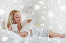 Happy Woman With Coffee And Cat In Bed At Home