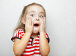 © Ilshat - Surprised little girl with open mouth and hands on cheeks