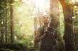 © StockPhotoPro - Photographer taking pictures in the forest