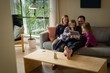 © Wavebreak Media - Family using laptop in living room