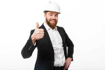 Sticker - Smiling bearded business man in protective helmet showing thumb up