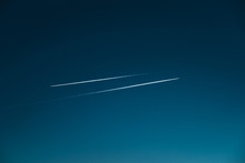 Two Aeroplane Traces Going In Opposite Directions