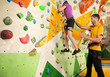 © Africa Studio - Little girl with trainer in climbing gym