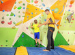 © Africa Studio - Little boy with trainer in climbing gym