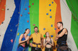 © Africa Studio - Young people in climbing gym