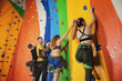 © Africa Studio - Young people in climbing gym