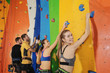 © Africa Studio - Young people in climbing gym