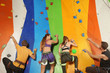 © Africa Studio - Young people in climbing gym