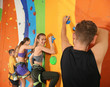 © Africa Studio - Young people in climbing gym