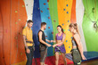 © Africa Studio - Young people in climbing gym