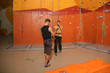 © Africa Studio - Young men in climbing gym