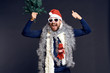 © SHOTPRIME STUDIO - man on a black background is happy, party, christmas clothes, holiday