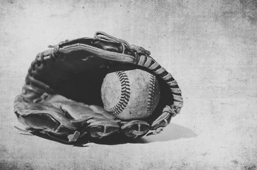 Sticker - Vintage style grunge image of baseball in glove, shows sport equipment for game.  Ball caught in mitt in black and white.
