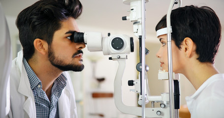 Poster - optometrist checking patient eyesight and vision correction