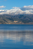 Fototapeta Natura - Amazing panoramic Landscape of Lake Pamvotida, Pindus mountain and city of Ioannina, Epirus, Greece